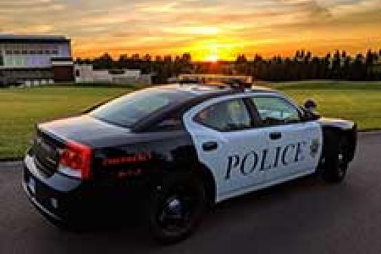 Police car in the sunset.