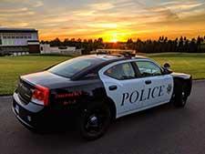 Police car in the sunset.